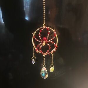 Elegant Gold and Red Spider Suncatcher